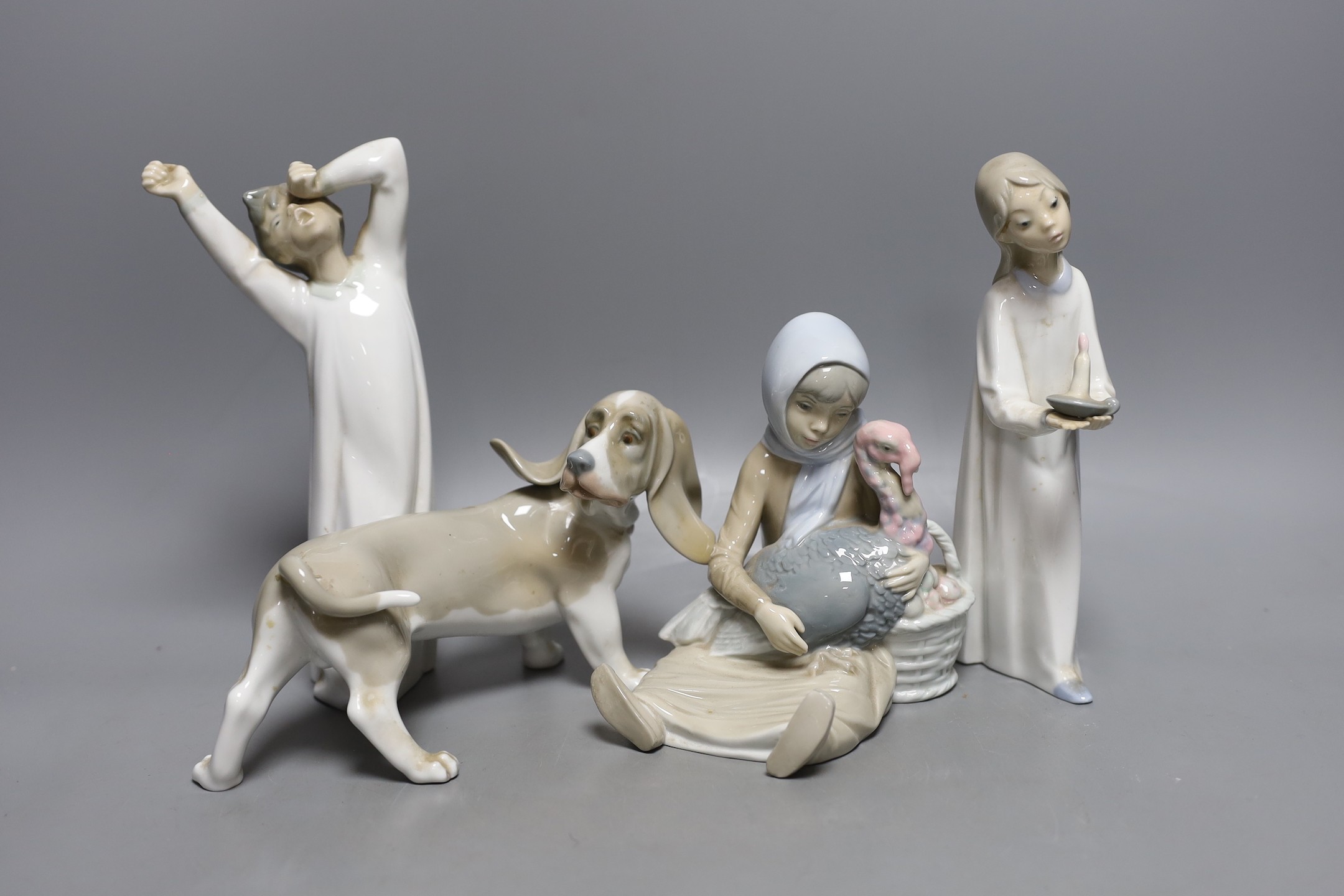 Four Lladro porcelain figures, tallest 22 cm